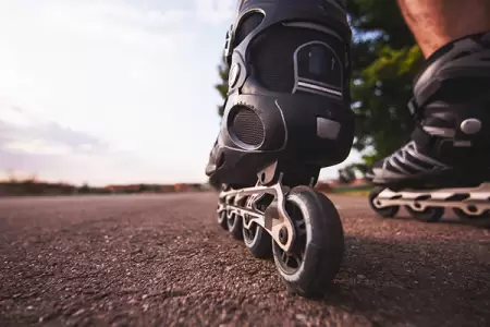 VIDEO: Dangerous Stunt: Roller Skaters Risk Lives Hanging onto Semi Truck on Highway