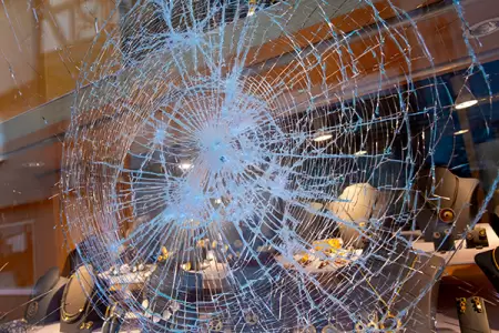 IMAGE: Man Arrested for Vandalizing Portland Police Precinct in Destructive Act