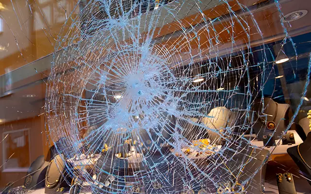 IMAGE: Man Arrested for Vandalizing Portland Police Precinct in Destructive Act